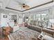 Bright and airy living room showcasing tray ceilings, comfortable seating, and expansive sliding glass doors at 16863 Se 110Th Court Rd, Summerfield, FL 34491