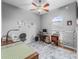Bright office space with a ceiling fan, desk, sewing machine and natural light at 16863 Se 110Th Court Rd, Summerfield, FL 34491