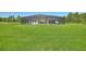Back of home with screened-in lanai and pool offers relaxation and privacy at 1702 Hidden Palms Dr, Davenport, FL 33897