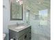 Elegant bathroom featuring marble tile and a glass enclosed shower at 1702 Hidden Palms Dr, Davenport, FL 33897