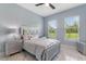 Serene bedroom with marble floors and stylish gray furniture at 1702 Hidden Palms Dr, Davenport, FL 33897