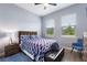 Cozy bedroom with a large bed, natural lighting, and comfortable furnishings at 1702 Hidden Palms Dr, Davenport, FL 33897