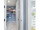 Walk-in closet with organized shelving and storage solutions, connecting to the bathroom at 1702 Hidden Palms Dr, Davenport, FL 33897