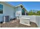 This property has a Generac generator and a modern air conditioner set against a backdrop of mulch and a sleek, white exterior at 1702 Hidden Palms Dr, Davenport, FL 33897