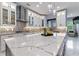Bright kitchen with modern white cabinetry, decorative tile backsplash, and a large island with seating at 1702 Hidden Palms Dr, Davenport, FL 33897