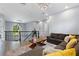 Open loft area with modern lighting, comfortable seating, and views of the staircase at 1702 Hidden Palms Dr, Davenport, FL 33897