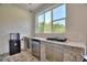 Outdoor kitchen with stainless steel appliances and bar seating at 1702 Hidden Palms Dr, Davenport, FL 33897