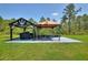 Outdoor patio area featuring shaded gazebos with grilling and seating perfect for entertaining at 1702 Hidden Palms Dr, Davenport, FL 33897