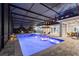 This property features a beautifully lit, screened-in pool and patio area, perfect for evening relaxation or entertaining guests at 1702 Hidden Palms Dr, Davenport, FL 33897
