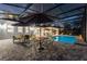 This screened-in pool and patio is an outdoor retreat complete with dining and lounge areas, perfect for entertaining or relaxation at 1702 Hidden Palms Dr, Davenport, FL 33897