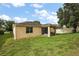 Back exterior view of home showing the screened in patio and yard at 20945 Oldenburg Loop, Mount Dora, FL 32757