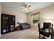 Home office featuring neutral walls, window, desk, loveseat and laminate floors at 20945 Oldenburg Loop, Mount Dora, FL 32757