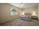 Bedroom features neutral walls, laminate floors, and a window at 20945 Oldenburg Loop, Mount Dora, FL 32757