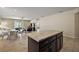 Open-concept kitchen island adjacent to dining and living room at 20945 Oldenburg Loop, Mount Dora, FL 32757