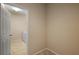 Pass through to Laundry Room with light tile flooring and white paint at 20945 Oldenburg Loop, Mount Dora, FL 32757