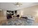 Bright living area with an open-concept layout into the kitchen and neutral colored walls at 20945 Oldenburg Loop, Mount Dora, FL 32757
