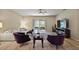 Comfortable living room features sliding glass doors to the lanai and stylish decor at 20945 Oldenburg Loop, Mount Dora, FL 32757