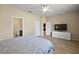 Main bedroom features neutral walls, laminate floors, and an ensuite bath at 20945 Oldenburg Loop, Mount Dora, FL 32757