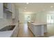 Kitchen with stainless steel appliances, quartz countertops, and a tile backsplash at 2208 Keystone Pass Blvd, Minneola, FL 34715