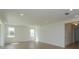 Spacious living room with tile floors and natural light at 2208 Keystone Pass Blvd, Minneola, FL 34715