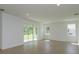 Bright living room with sliding glass doors leading to the patio and backyard at 2208 Keystone Pass Blvd, Minneola, FL 34715