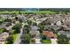 Beautiful aerial view showcases the well-maintained neighborhood and the home's desirable location near open green spaces at 2265 Hackney Way, The Villages, FL 32162