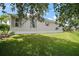 Lawn view of house siding, shutters and manicured lawn at 2265 Hackney Way, The Villages, FL 32162