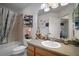 Bathroom features a tub with shower and a neutral countertop and cabinets at 2265 Hackney Way, The Villages, FL 32162