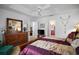 Well-lit bedroom shows doorways to other rooms and neutral carpet at 2265 Hackney Way, The Villages, FL 32162