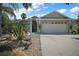 Charming single-story home boasts a two-car garage, well-manicured landscaping, and a welcoming entrance at 2265 Hackney Way, The Villages, FL 32162