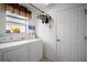 Laundry room features a washer and dryer and a window at 2265 Hackney Way, The Villages, FL 32162