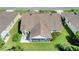 Aerial view of the home's backyard and screened-in patio at 2369 Unity Ter, The Villages, FL 32162