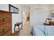 Bedroom features a light blue bed set and carpet flooring at 2369 Unity Ter, The Villages, FL 32162