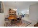 Bright dining room features a chandelier, hutch, and decorative rug at 2369 Unity Ter, The Villages, FL 32162