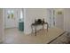 Spacious entryway featuring ceramic tile flooring, a decorative table, and access to multiple rooms at 2369 Unity Ter, The Villages, FL 32162