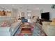 Open concept living room featuring large sofas and lots of natural light at 2369 Unity Ter, The Villages, FL 32162