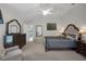 Comfortable main bedroom boasts a vaulted ceiling, ceiling fan, and elegant furniture at 2369 Unity Ter, The Villages, FL 32162