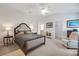 Serene main bedroom featuring vaulted ceiling, ceiling fan, and ample natural light at 2369 Unity Ter, The Villages, FL 32162