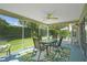 Screened-in lanai with a ceiling fan and comfortable outdoor seating, perfect for enjoying the Florida weather at 2369 Unity Ter, The Villages, FL 32162