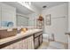 Bathroom boasting a sink vanity, decorative accents, and functional layout for daily use at 2488 Begonia St, Mascotte, FL 34753