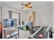 Bedroom space featuring natural light, ceiling fan, and ample space for comfort and versatility at 2488 Begonia St, Mascotte, FL 34753
