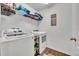 Functional laundry room with modern washer and dryer, plus storage for convenience at 2488 Begonia St, Mascotte, FL 34753