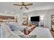 Open-concept living room connected to the kitchen, featuring ample seating and modern decor at 2488 Begonia St, Mascotte, FL 34753