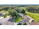 Aerial capture of residences with verdant landscaping and private drives at 26338 Glen Eagle, Leesburg, FL 34748