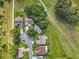 Overhead aerial view of residential homes in a well-maintained neighborhood near a lush golf course at 26338 Glen Eagle, Leesburg, FL 34748