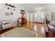 Welcoming foyer featuring wood-look flooring and ample natural light from leaded glass door inserts at 26338 Glen Eagle, Leesburg, FL 34748