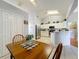 Bright kitchen featuring white cabinetry, stainless appliances, and open layout at 26338 Glen Eagle, Leesburg, FL 34748