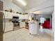 Bright kitchen with white cabinets, stainless steel appliances and tile flooring at 26338 Glen Eagle, Leesburg, FL 34748