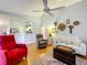 Open-concept living room with hardwood floors and views into kitchen at 26338 Glen Eagle, Leesburg, FL 34748