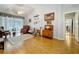 Comfortable living room featuring vaulted ceiling and bright natural light from sliding glass doors at 26338 Glen Eagle, Leesburg, FL 34748